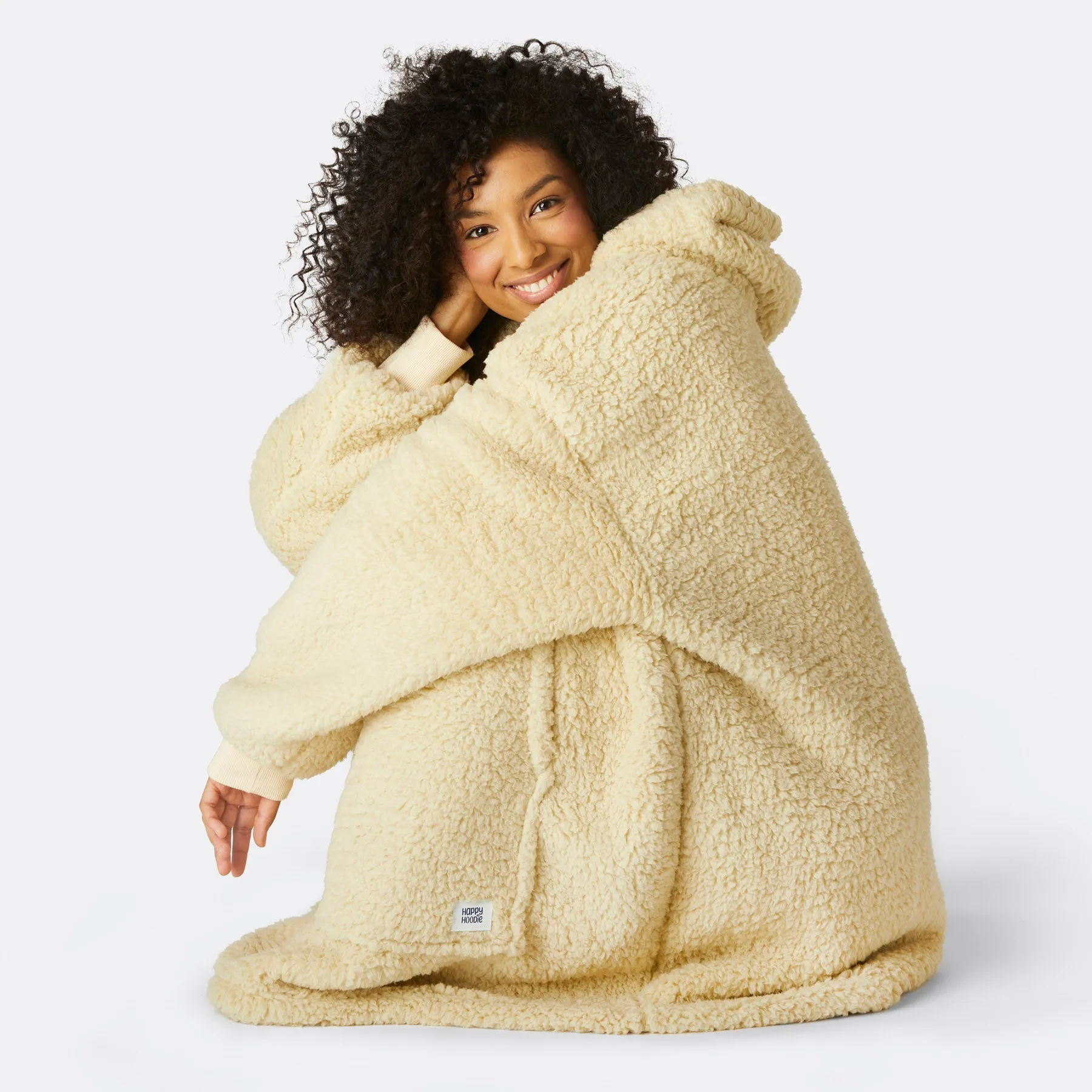 Sure! The optimized title for this e-commerce product could be Cozy Beige Sherpa HappyHoodie.