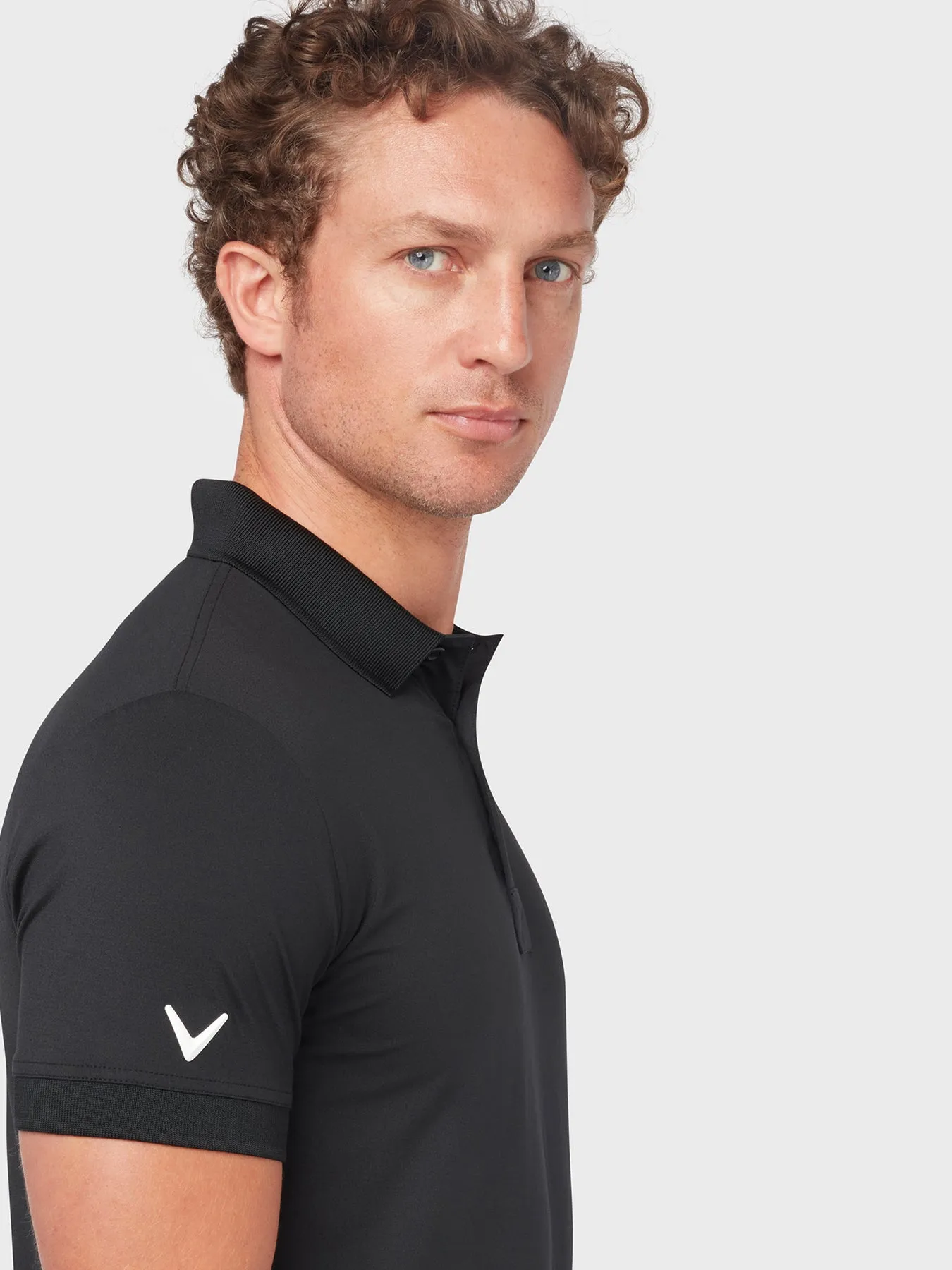 X Series Solid Ribbed Polo In Caviar